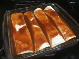 Topping Enchiladas with Enchilada Sauce @ bestwithchocolate.com