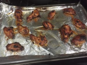 Wings fresh from the oven for Miso Glazed Chicken Wings @ bestwithchocolate.com