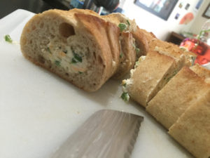 Slicing up Jalapeno Popper Stuffed Bread @ bestwithchocolate.com