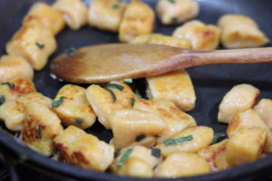 Sauteeing gnocchi for Butter Sage Sweet Potato Gnocchi @ bestwithchocolate.com