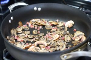 Sauteeing mushrooms and pancetta for Goat Cheese Mushroom Pasta @ bestwithchocolate.com
