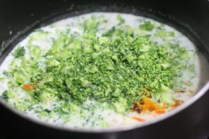 Adding broccoli to Broccoli Cheddar Soup @ bestwithchocolate.com