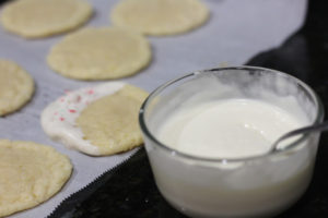 Dipping cookies for Peppermint Sugar Cookies @ bestwithchocolate.com