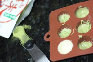 Painting chocolate shells for Matcha Green Tea Truffles @ bestwithchocolate.com
