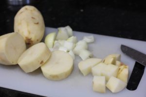 Chopping onion and potato for Potato Pancakes @ bestwithchocolate.com