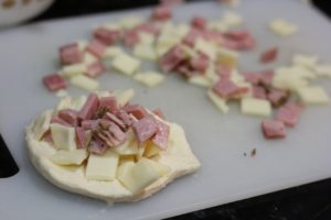 Adding stuffing for Stuffed Swiss & Ham Rolls @ bestwithchocolate.com