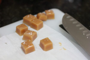 Cutting up salted caramels for Salted Caramel Truffles @ bestwithchocolate.com