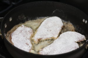 Pan searing chicken for Chicken Picatta @ bestwithchocolate.com