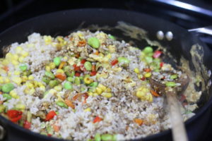 Mixing rice into Vegetable Fried Rice @ bestwithchocolate.com