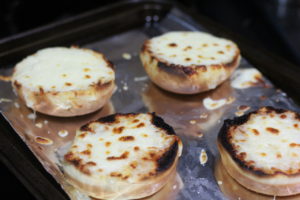 Melting mozzarella cheese on buns for French Onion Burgers @ bestwithchocolate.com