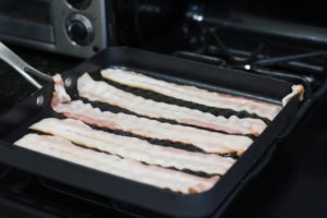 Frying up bacon for Black & Blue Sliders @ bestwithchocolate.com