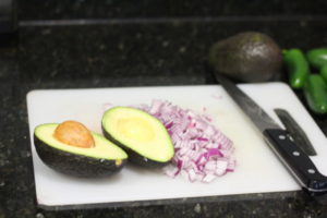 Chopping onions and avocados for Guacamole @ bestwithchocolate.com