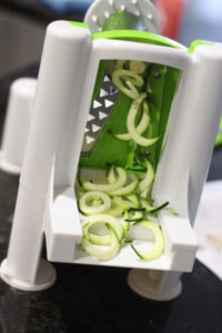 Spiralizing zucchini for Rainbow Vegetable Pad Thai @ bestwithchocolate.com