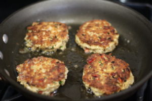 Frying up Salmon Cakes @ bestwithchocolate.com