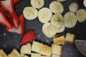 Cutting fruits and poundcake for Strawberry Banana Poundcake Parfait @ bestwithchocolate.com