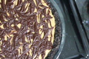 Swirling chocolate and peanut butter for Peanut Butter Pie @ bestwithchocolate.com