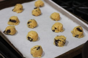 Scooping cookie dough balls for Perfectly Chewy Chocolate Chip Cookies @ bestwithchocolate.com