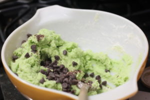 Adding chocochips to mint chocolate chip cookie dough @ bestwithchocolate.com
