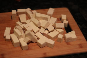 Chopping tofu for Soy Marinated Tofu @ bestwithchocolate.com