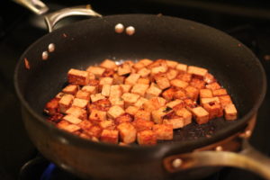 Searing the tofu in a hot pan for Soy Marinated Tofu @ bestwithchocolate.com