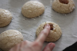 Adding pecans to freshly baked Butter Pecan Cookies @ bestwithchocolate.com