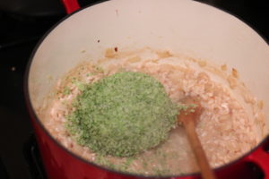 Adding broccoli to Broccoli Cauliflower Risotto @ bestwithchocolate.com