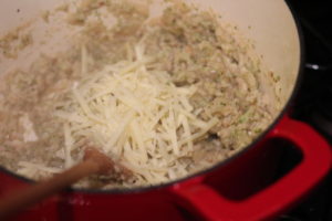 Adding cheese to Broccoli Cauliflower Risotto @ bestwithchocolate.com