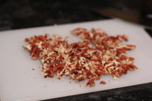 Chopping pecans for Pecan Saltine Toffee @ bestwithchocolate.com