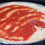 Spreading sauce on Pizza Crust @ bestwithchocolate.com