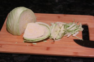 Chopping cabbage for the filling of Vegetable Egg Roll @ bestwithchocolate.com