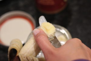 Slicing banana for Banana Almond Butter Chia Seed Pudding @ bestwithchocolate.com