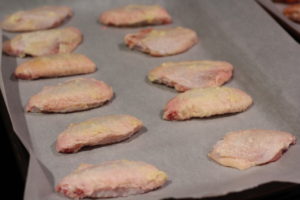 Laying out seasoned wings for Garlic Peri-Peri Wings @ bestwithchocolate.com