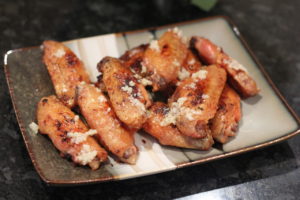 Wings topped with fresh garlic for Garlic Peri-Peri Wings @ bestwithchocolate.com