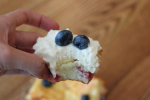 Two Ingredient Lemon Cake Bars topped with blueberries and whipped cream @ bestwithchocolate.com