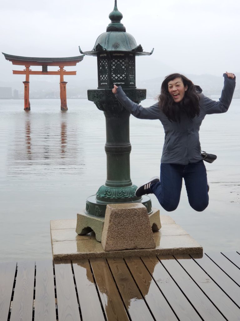 Me jumping at the Floating Otorii gate on Miyajima Island @ bestwithchocolate.com