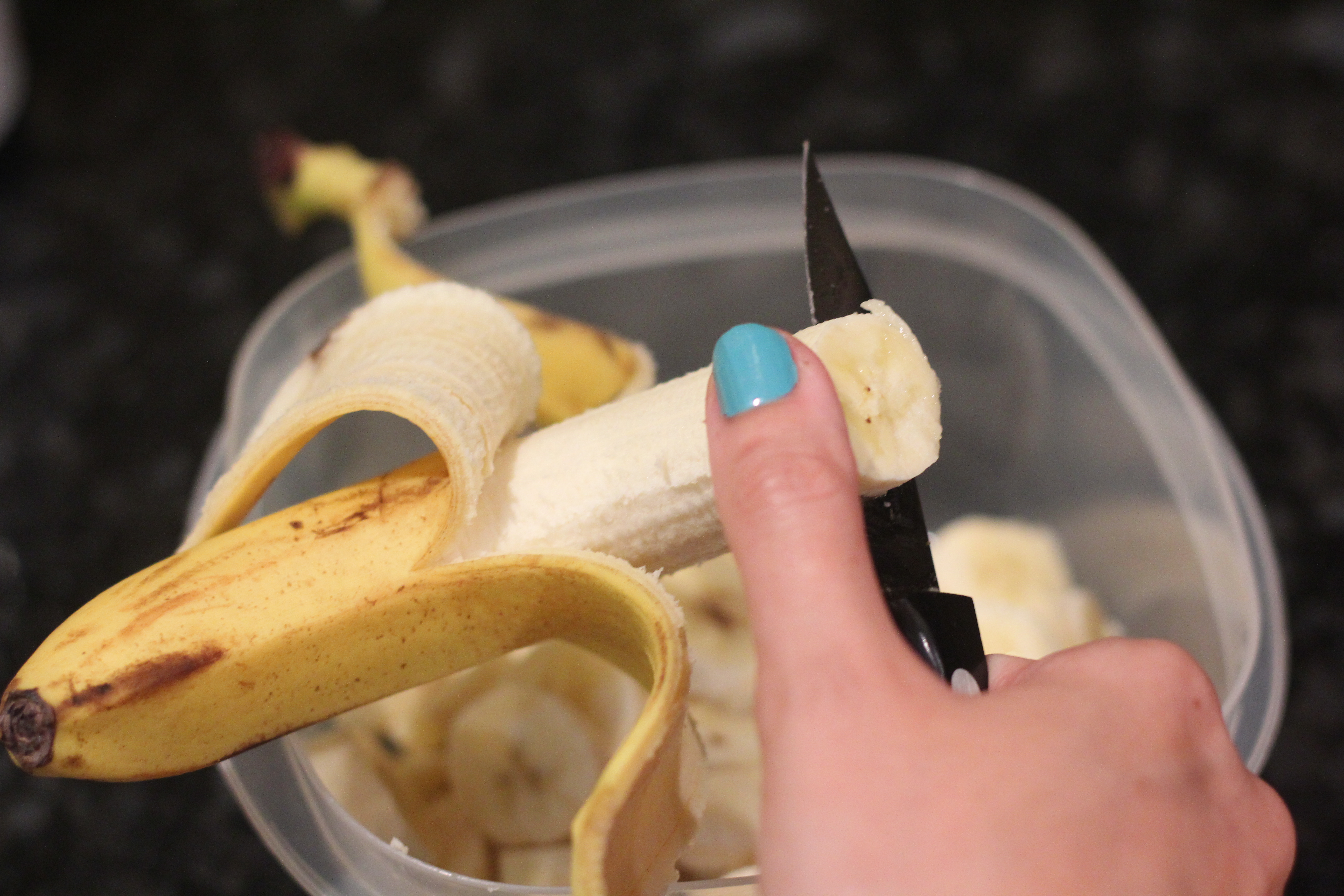 Slicing ripe bananas for Banana Peanut Butter Ice Cream @ bestwithchocolate.com