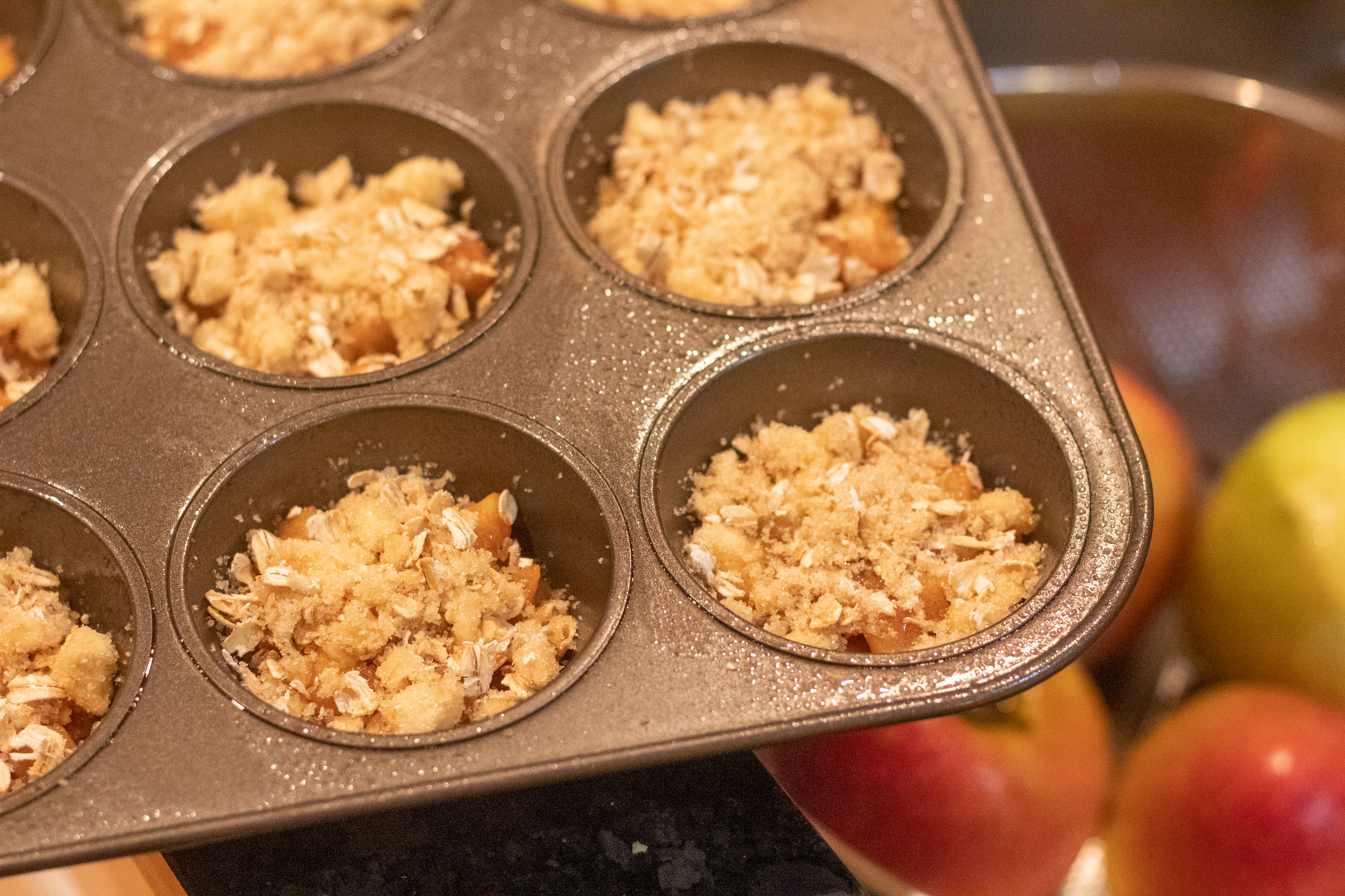 Adding crumble topping to Apple Crisp Cookies @ bestwithchocolate.com