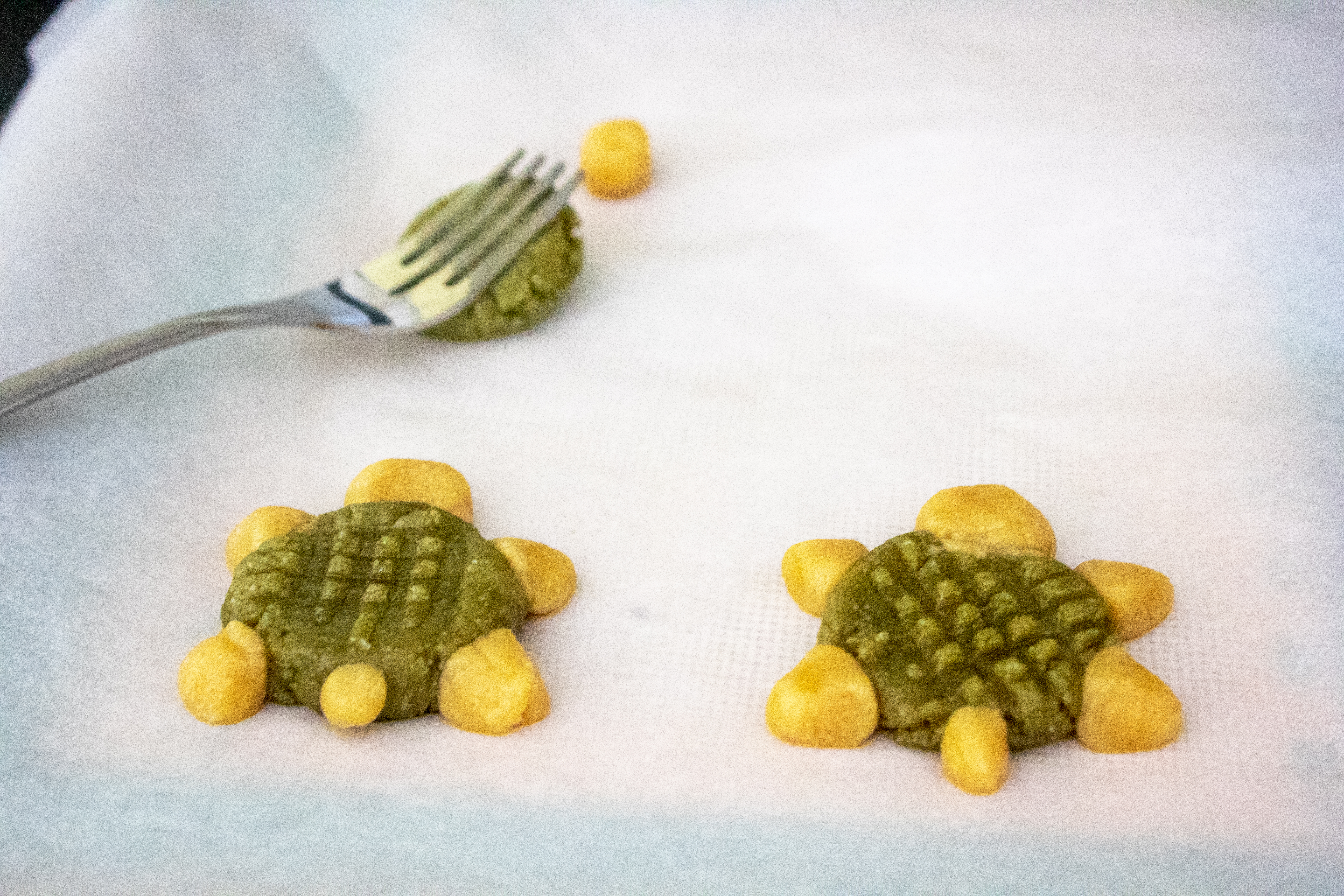 Flattening shells for Matcha Tahini Turtle Cookies @ bestwithchocolate.com