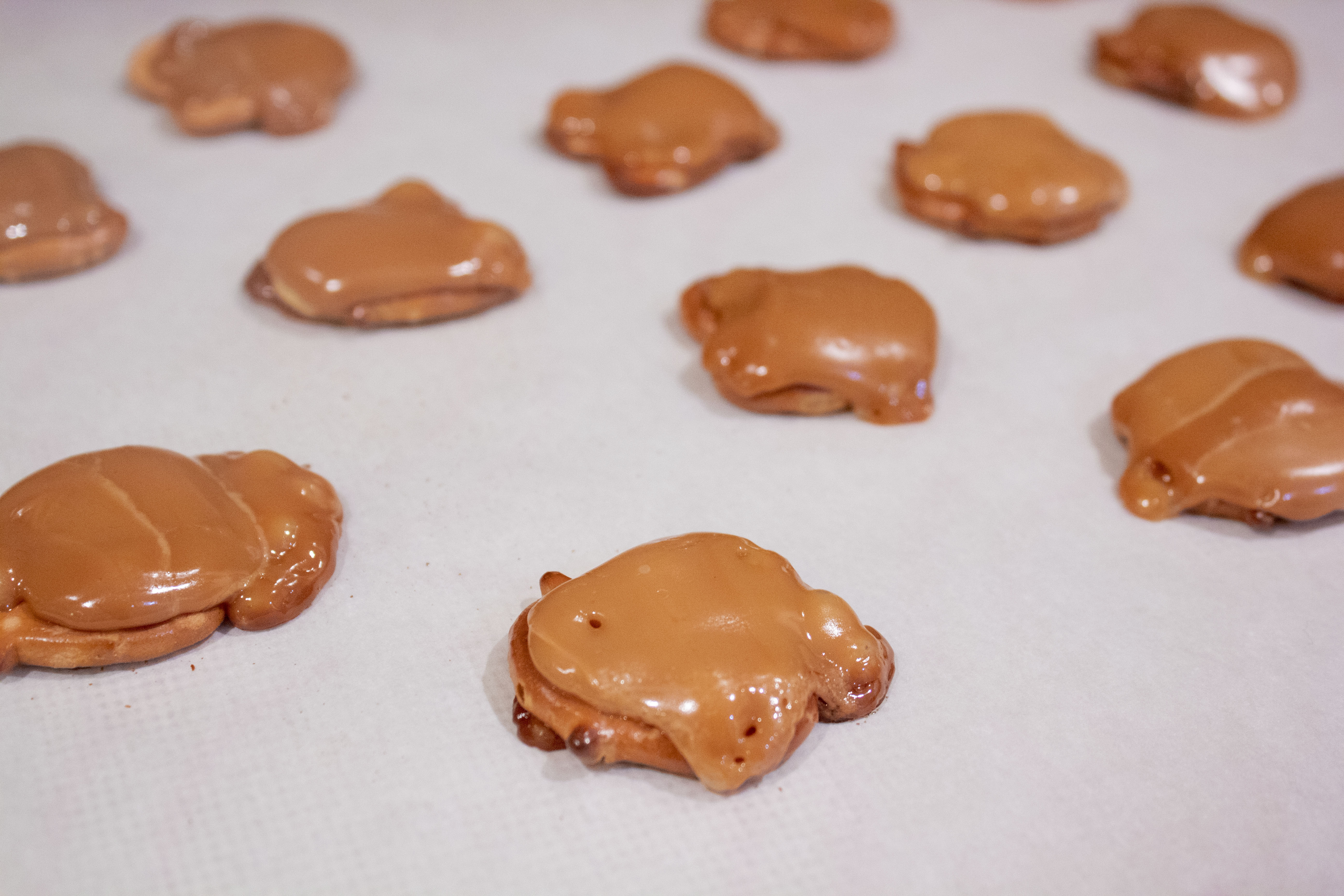 Melted caramel pretzels from the oven for White Chocolate Bunny Butts @ bestwithchocolate.com