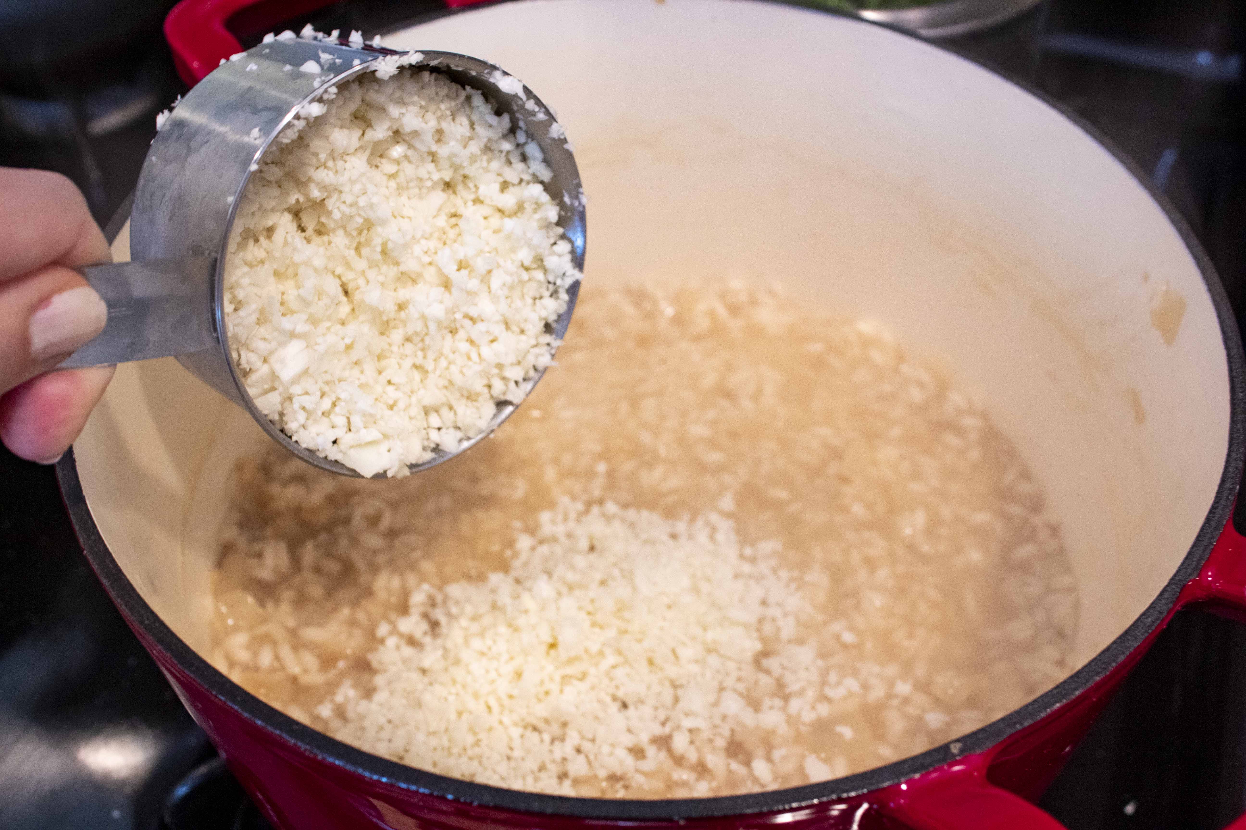 Adding riced cauliflower to Lightened Up Risotto @ bestwithchocolate.com