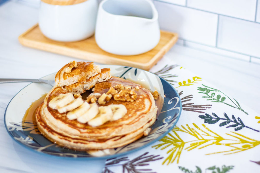 Healthful Greek Yogurt Pancakes with dish towel and syrup