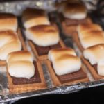 Freshly toasted marshmallows from the oven on top of graham crackers and chocolate squares