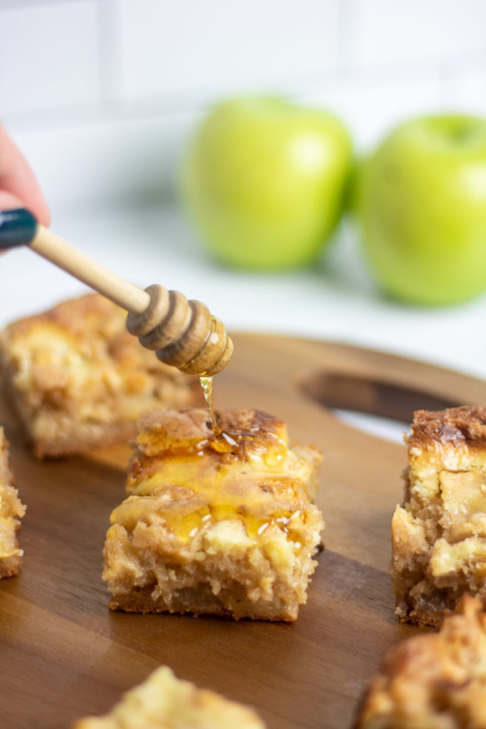 Drizzling cream cheese apple cake with honey