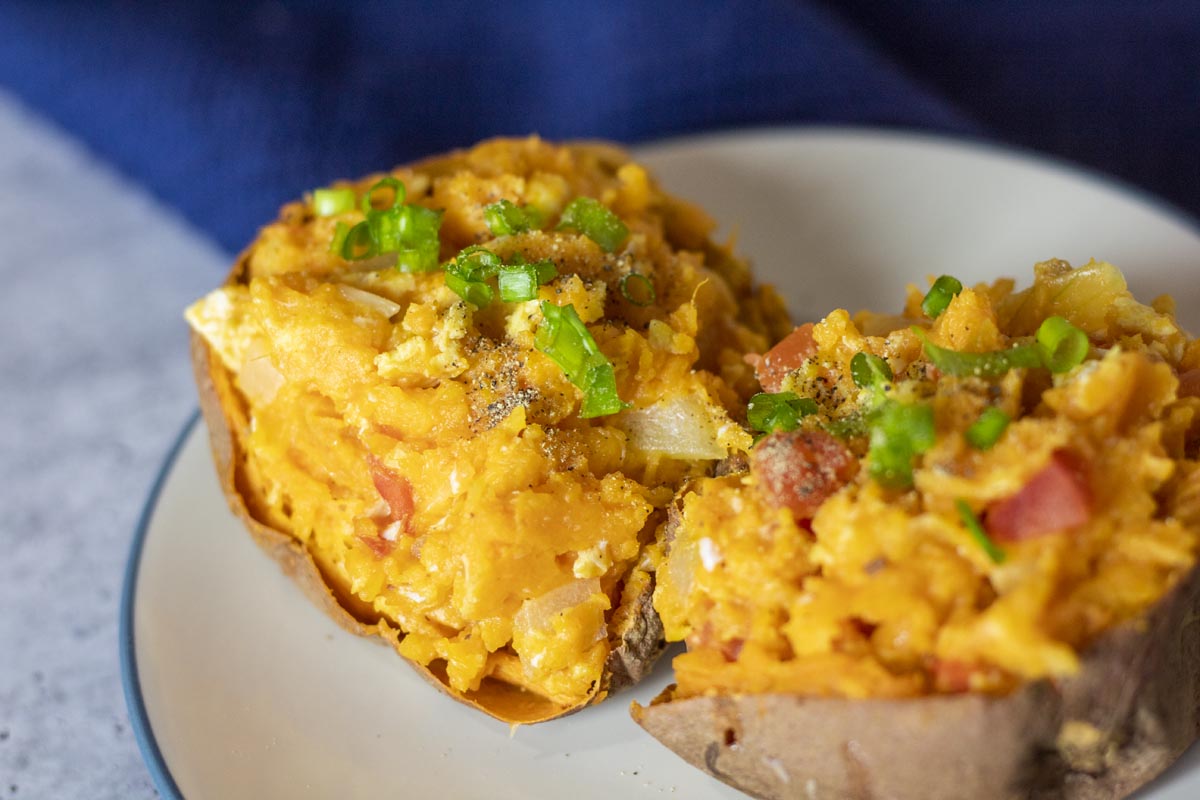 closeup of breakfast sweet potatoes topped with chives