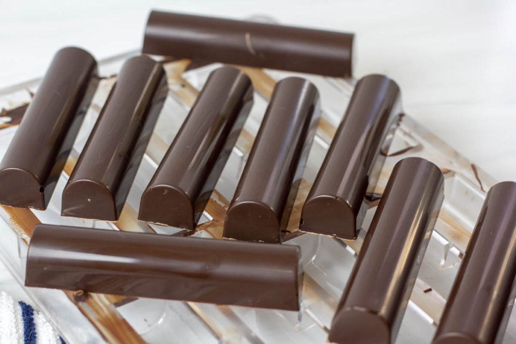tempering chocolate bars on a polycarbonate mold