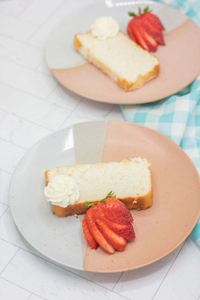 Various slices of angel food cake loaf adorned with strawberries