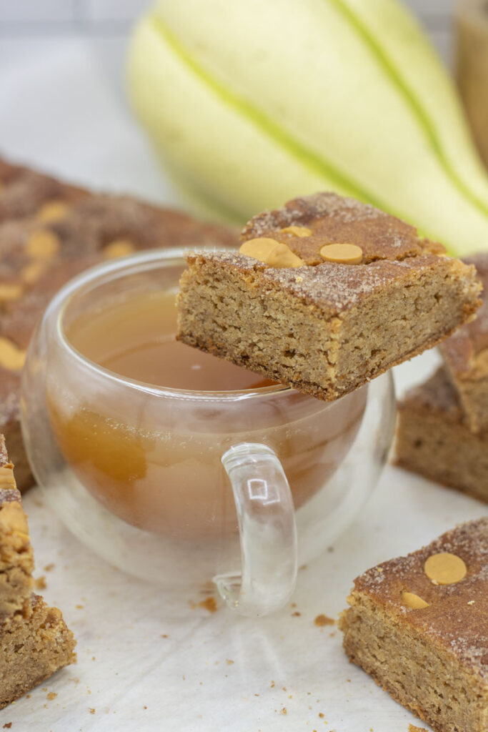 Caramel apple cider bar perched on a mug of cider