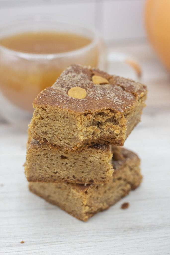 Caramel apple cider cake bars in a stack