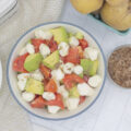 A bowl of avocado caprese salad and smoked salt