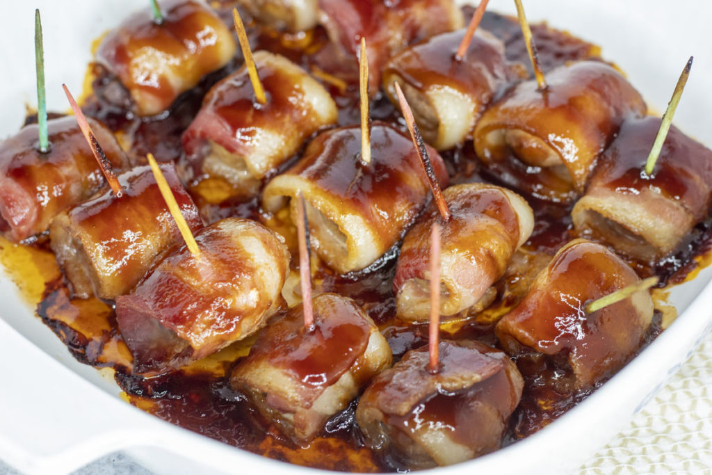 close-up of bacon wrapped waterchestnuts, fresh from the oven